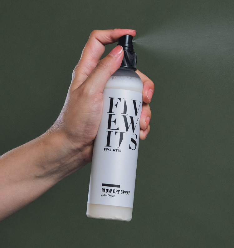 close up hand spray Five Wits blow dry spray