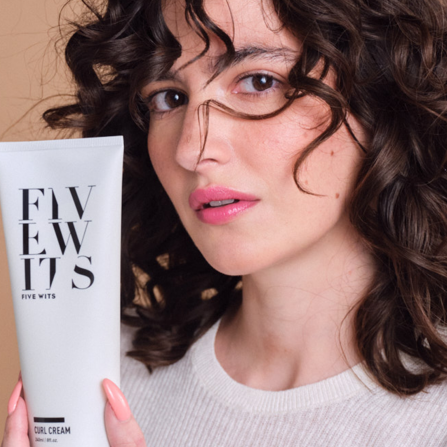 woman displaying Five Wits cure cream