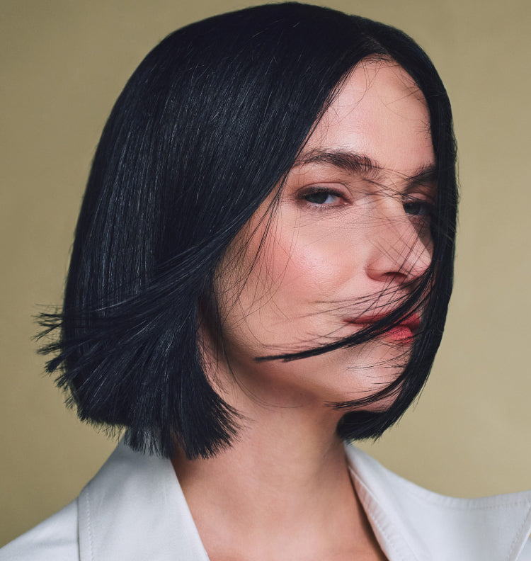 woman bob cut, hair blowing in wind