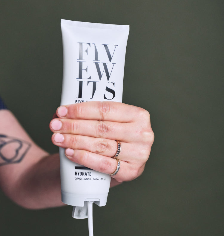 hand squeezing Five Wits hydrate conditioner
