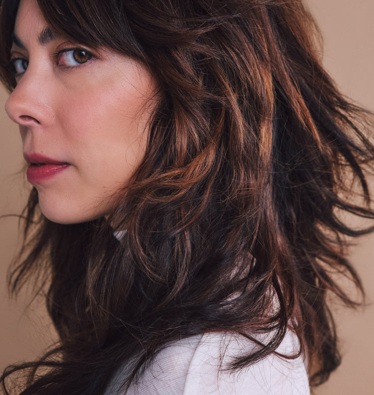 profile of woman, long hair blown in wind