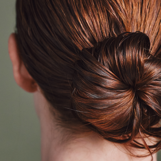 close up red hair in bun