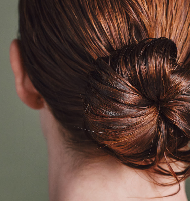 close up of red hair in bun