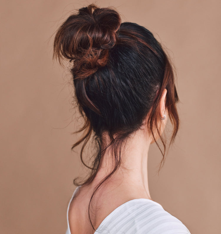 back of woman with hair in bun